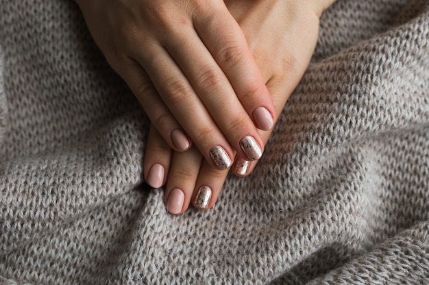 Female hands with manicure and pink polished nails