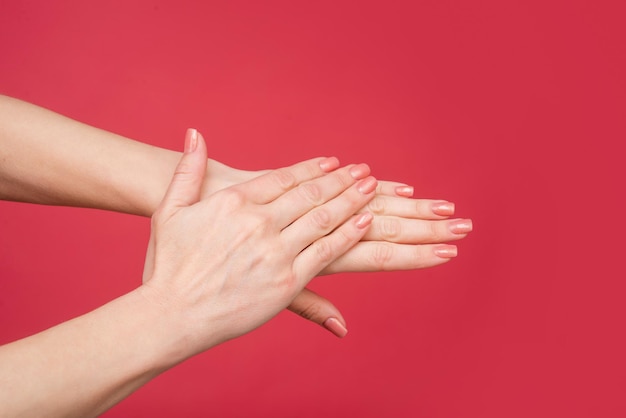 Female hands with manicure and smooth skin