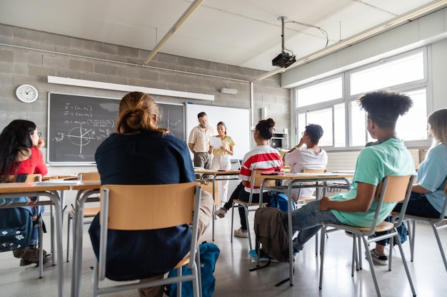 Female high school student giving a presentation to multiracial classmates Copy space Education