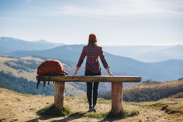 Female hiker resting on top of the mountaing