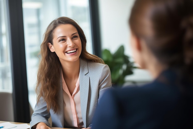 Female hiring manager interviewing a job candidate in her office