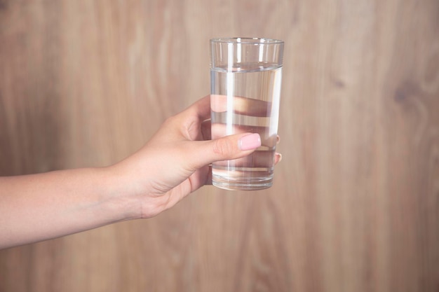 Female holding a glass of water