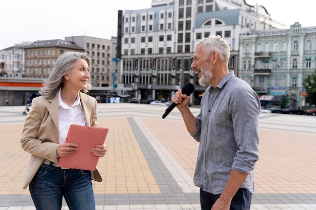 Female journalist working outdoors