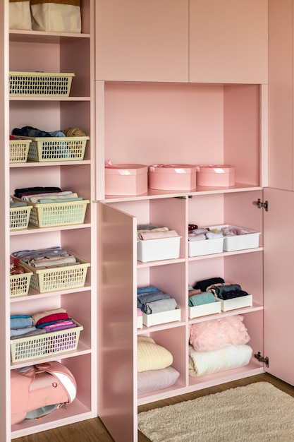 Female kid pink closet with comfortable vertical storage clothes organization case box