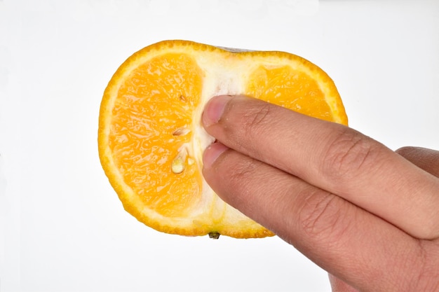 Female masturbation concept finger penetrating in orange slice