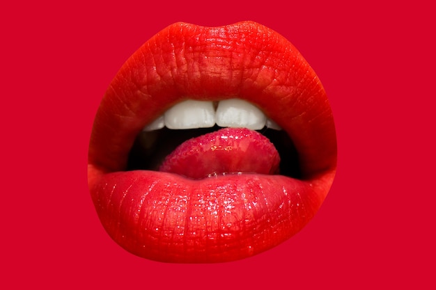 Female mouth isolated with red lipstick and tongue licking lips Lick lip tongue isolated on red Tongue in the mouth closeup