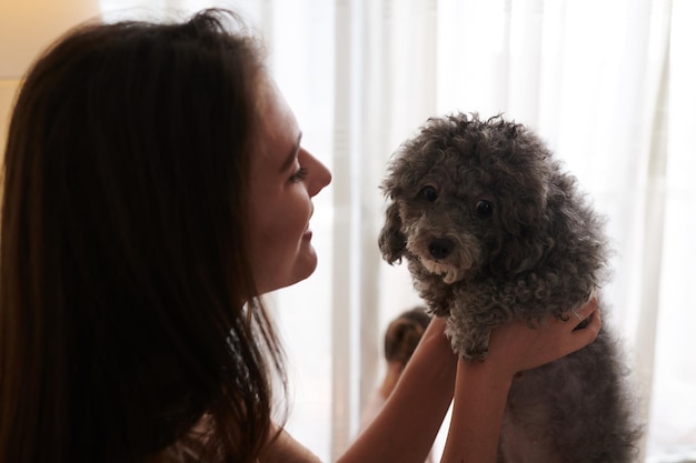 Female Owner Holding Dog