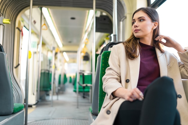 Female passenger sitting in public transport