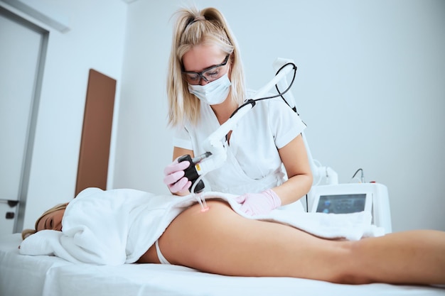 Female patient getting rid of cellulite on the problem area