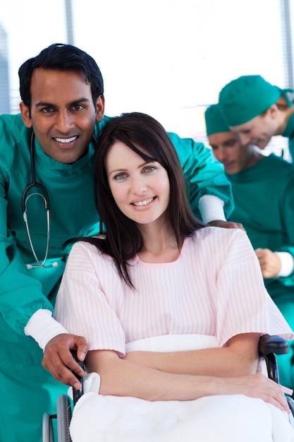 Female patient with her surgeon smiling at the camera 