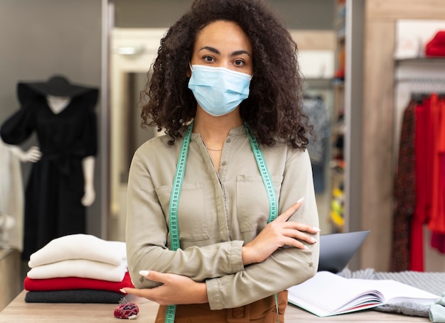 Female personal shopper with mask working