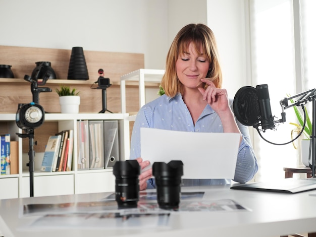 Female photographer working at office studio