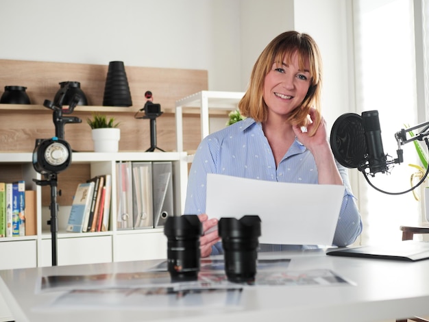 Female photographer working at office studio