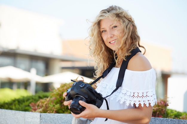 Female photographer working in urban environment