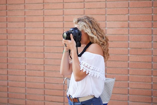 Female photographer working in urban environment