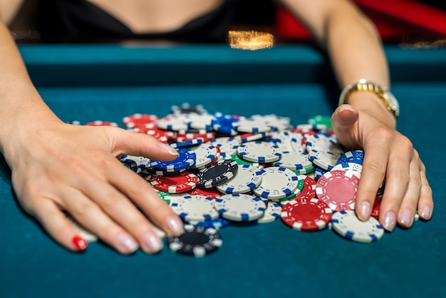 Female player checking how much winning at casino poker game