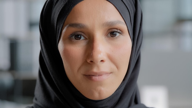 Female portrait closeup arabic female face attractive serious muslim woman in hijab with natural