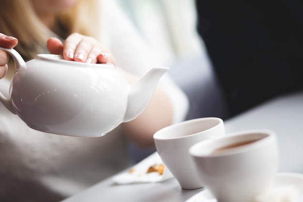 Female pouring tea