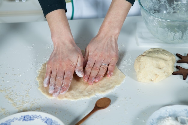 Female preparing pie with Ingredients for baking cake