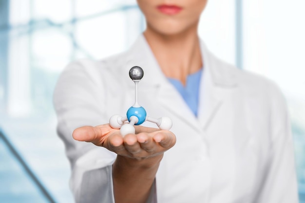 Female scientist holding a molecular Structure