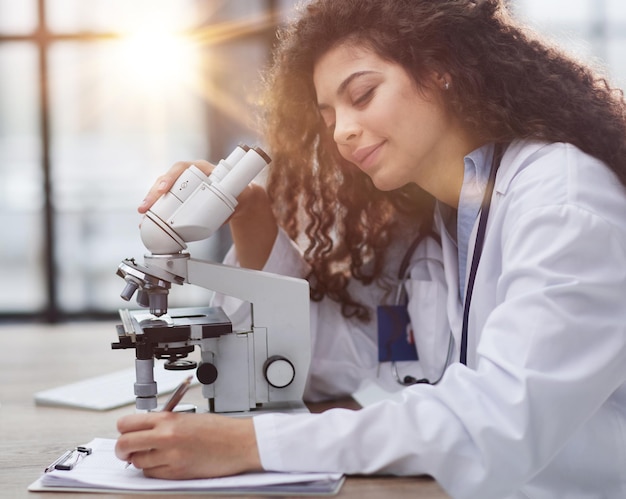 Female scientist researcher conducting an experiment in a labora