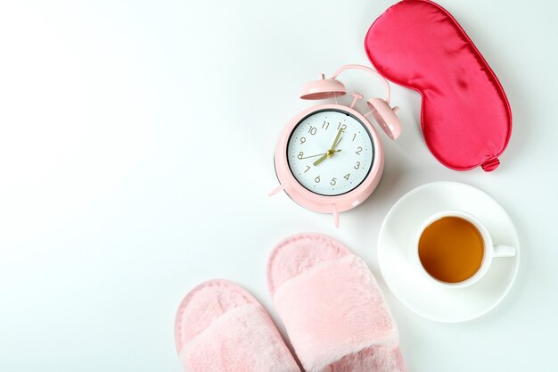 Female sleep routine accessories on white background