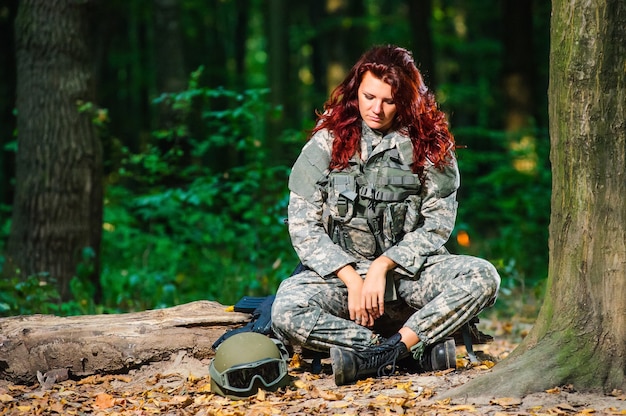 Female soldier in the forest