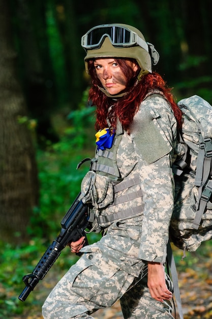 Female soldier in the forest