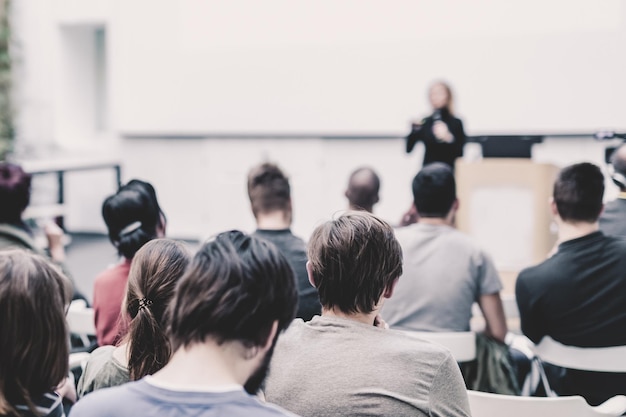 Female speaker giving presentation on business conference