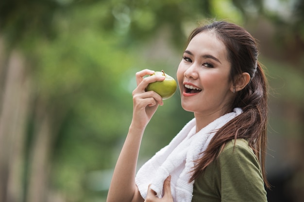 Female sport eating an apple