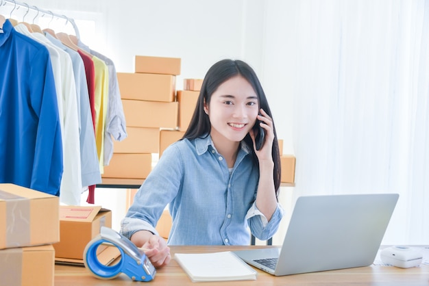 Female startup small business owner working with notebook computer at office