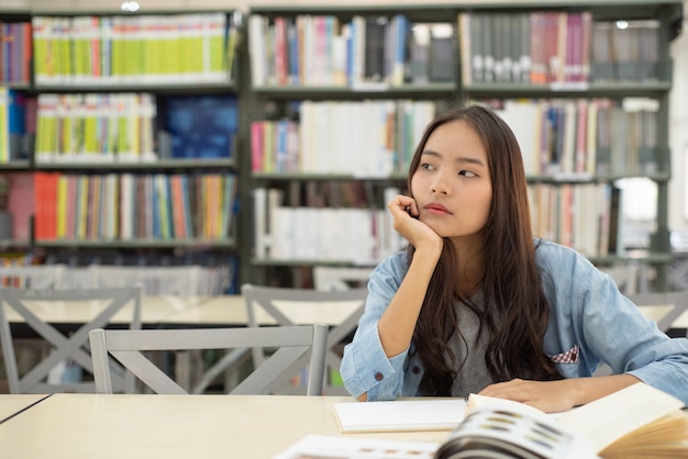 female students are searching for research papers.