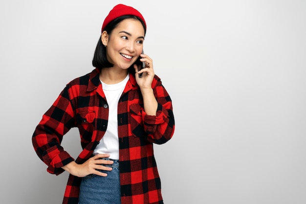 Female talking phone with friend expressing positive emotions during conversation