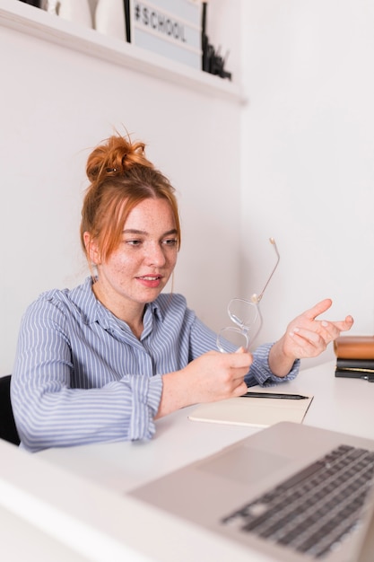 Female teacher explaining to students during an online class