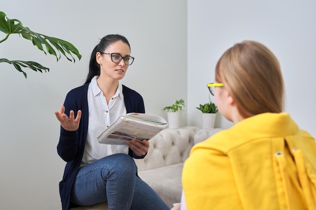 Female teacher teaching individually lesson for preteen girl