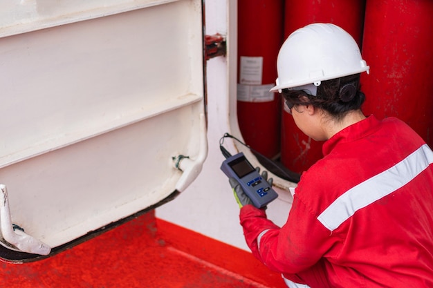 Female technician gathering data at industrial site