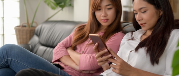 Female teenagers looking at smartphone