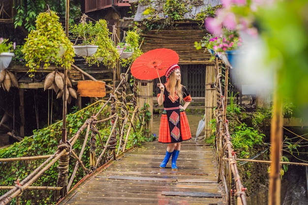 A female tourist dressed in the traditional dress of the inhabitants of the vietnamese mountains the