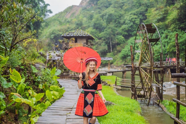 A female tourist dressed in the traditional dress of the inhabitants of the vietnamese mountains the