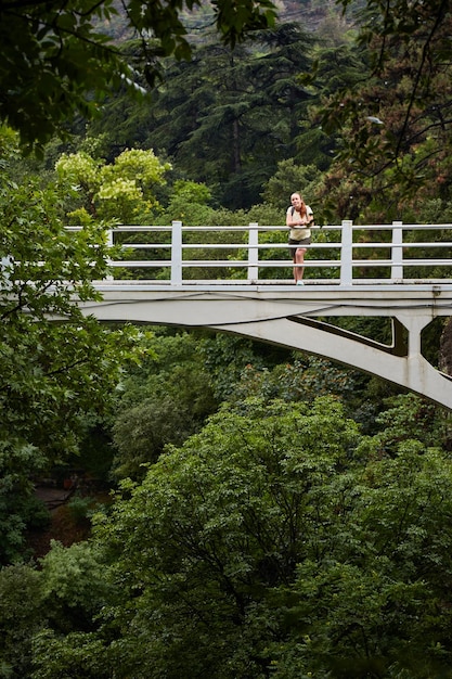 Female tourist in Tbilisi botanical garden Rainy day in Tbilisi botanical garden Tbilisi Georgia