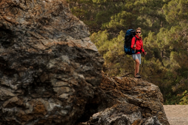 Female trekker hikes on hills in Turkey