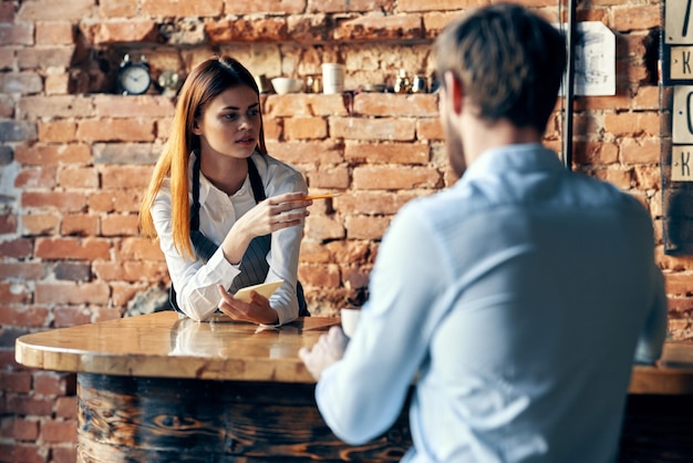 Female waiter next to customer service lifestyle work