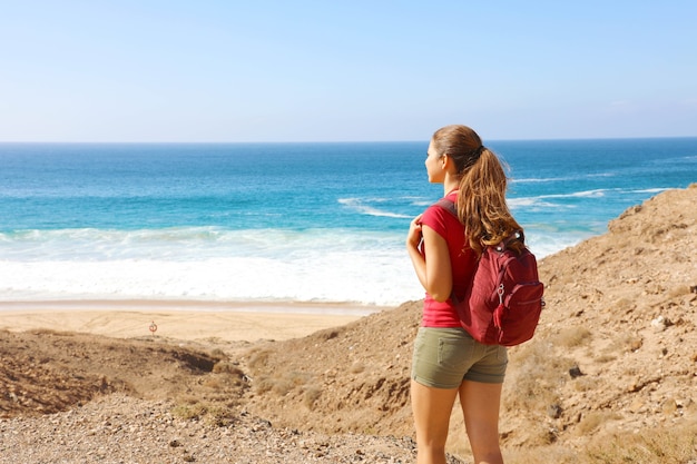 Female with a backpack enjoying the view