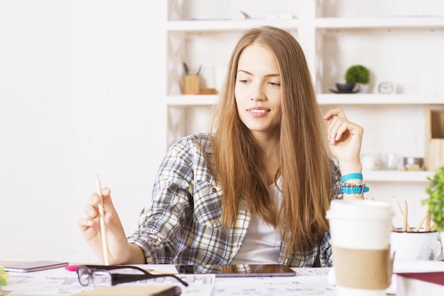 Female with pencil in office