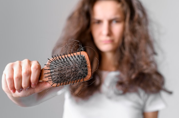 Female with tangled  hair and brush