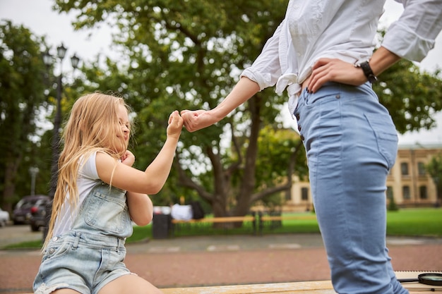 female with young girl spending time in the outdoors in the summer day