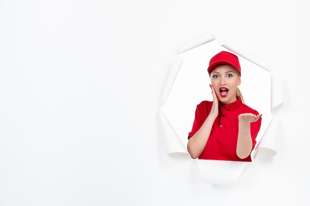 Female worker in red uniform on white