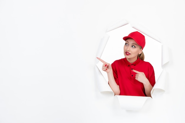 Female worker in red uniform on white