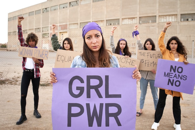 Feminist with a banner at a protest