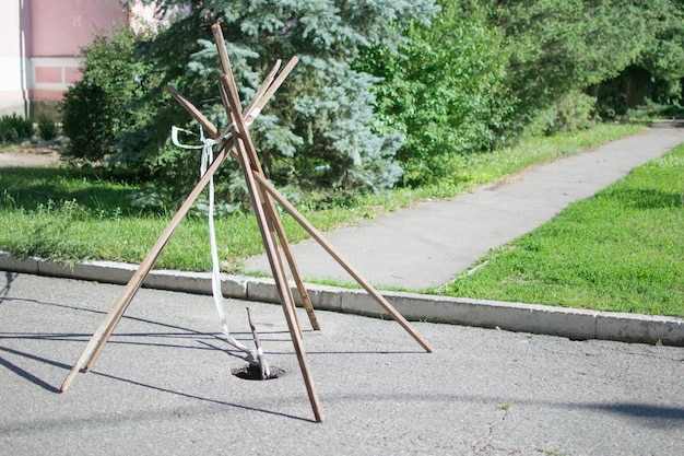 A fenced pit on the road